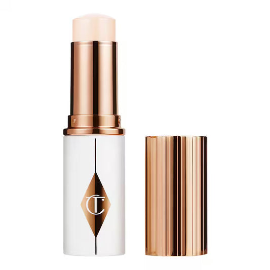 CHARLOTTE TILBURY Unreal Skin Sheer Glow Tint - Stick Fond de teint Hydratant